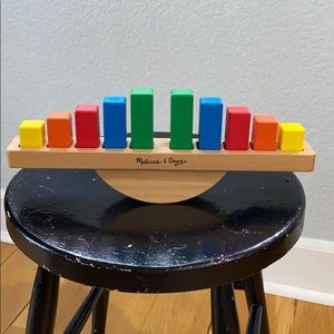 Toddler rainbow balance toy.